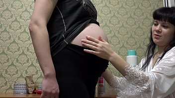 Cream on the body of a pregnant girlfriend, a lesbian licks a big belly and natural tits.